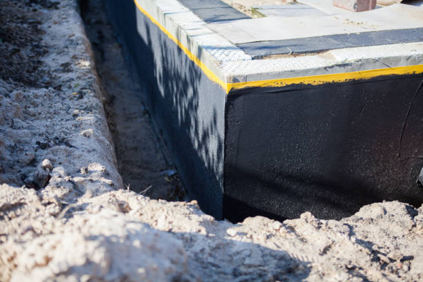 Professional Waterproofing technician working in Westwood, MI